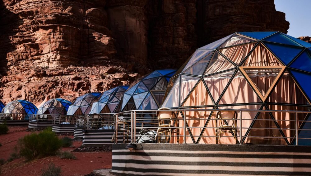 houses with glass walls on desert