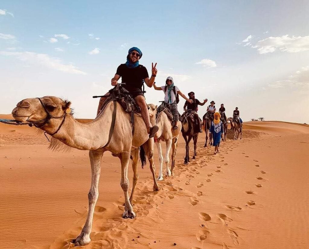 riding a camel in desert merzouga